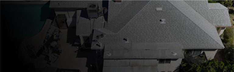 Aerial view of large asphalt shingle roof on residential property