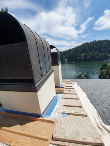 Roofing technician installing architectural shingles over ProArmor underlayment for a weatherproof roofing system